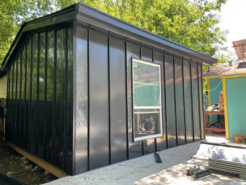 Black standing seam metal wall panels for Roof Inspection in Oakfield