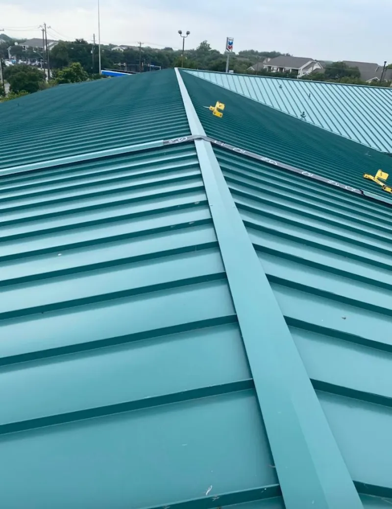 Green commercial metal roof ridge and valley for Metal Roof Repair in Oakfield
